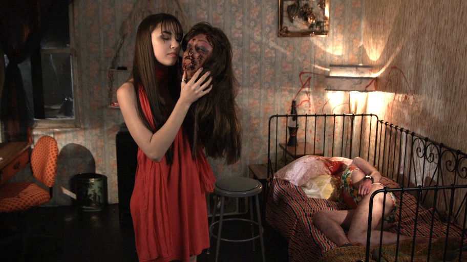 April Carson recites Hamlet to Gigi's severed head. Photograph by Petr Maur