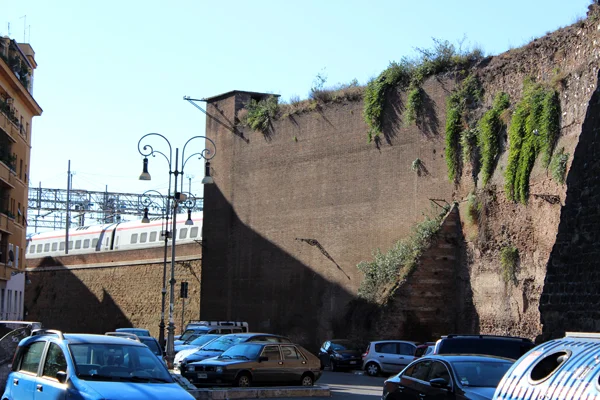 The Aurelian Wall built between 271 AD and 275 AD is still intricately woven within the fabric of Rome. Many areas of the wall have been colonized by opportunistic plants such as the ones you see here. These are actually edible capers (Capparis Spinoza).