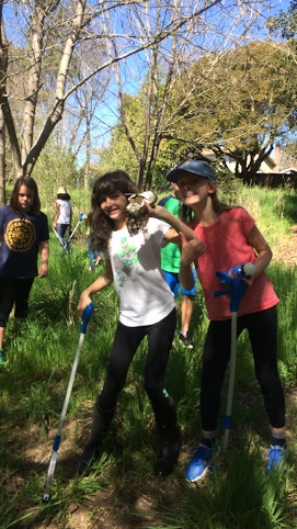  Students conducting a clean up of Thompson Creek. 