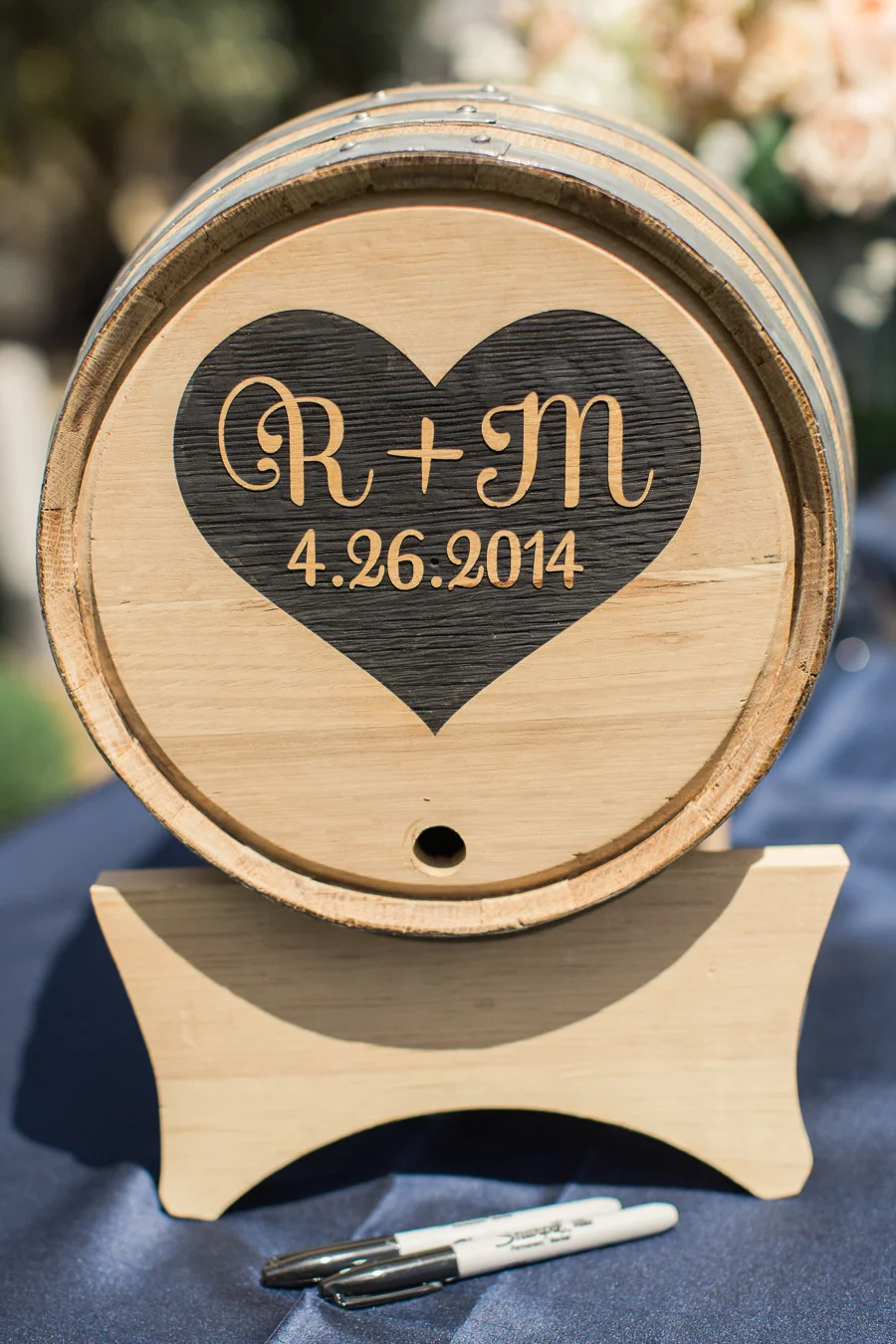 We branded a real oak wine barrel with the couple’s monogram for guests to sign. Photo by Carlie Statsky.