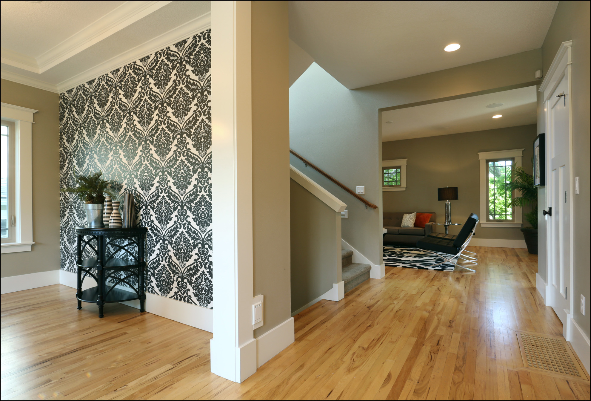 View walking in front door - entry with closet and powder room