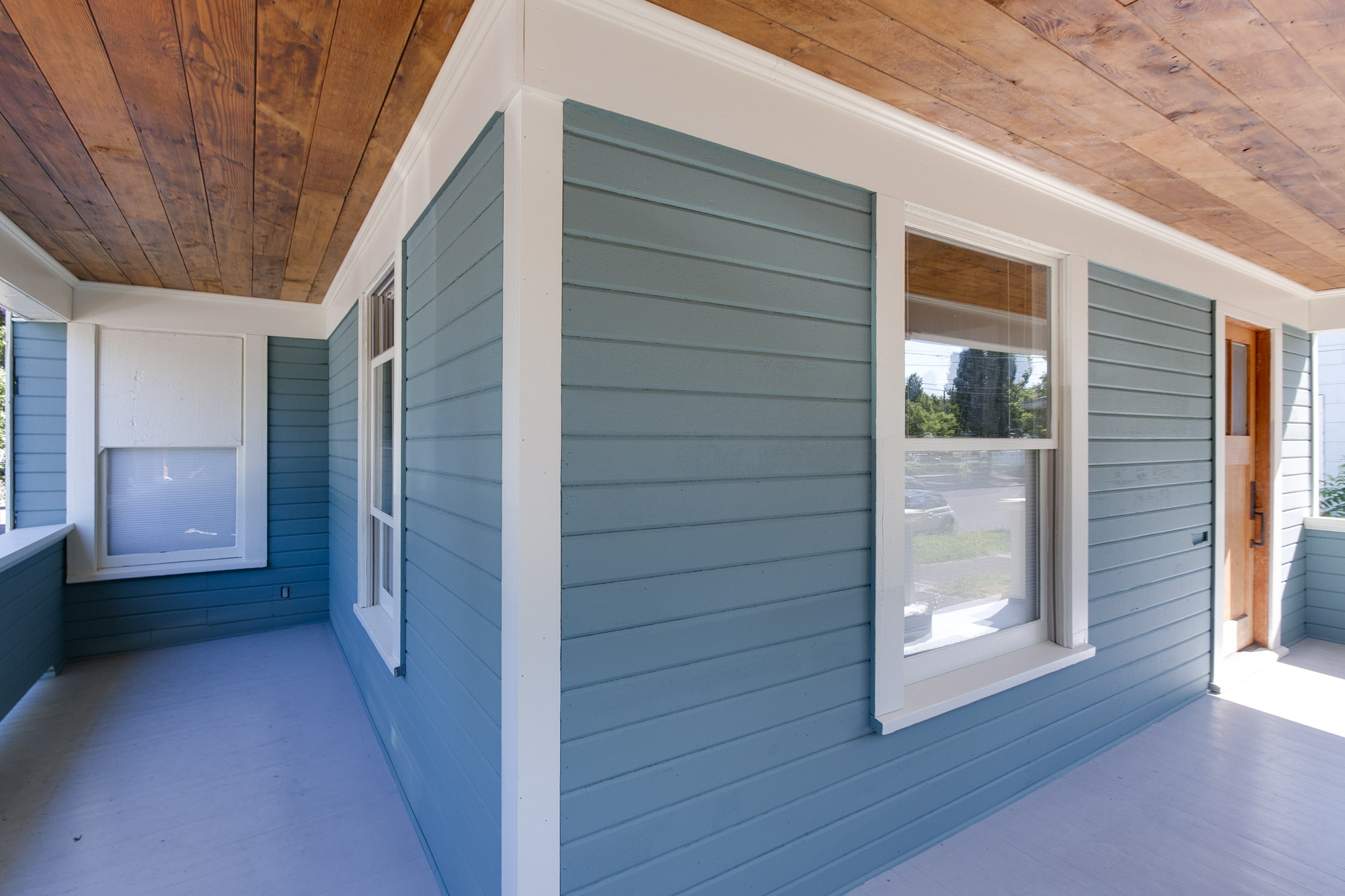 Covered porch adds charm and beauty
