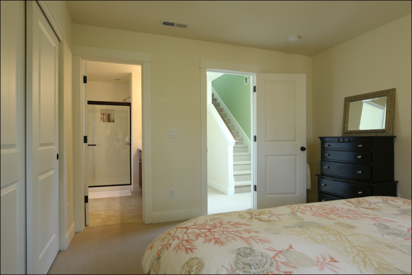 view from master bedroom into bath and hallway