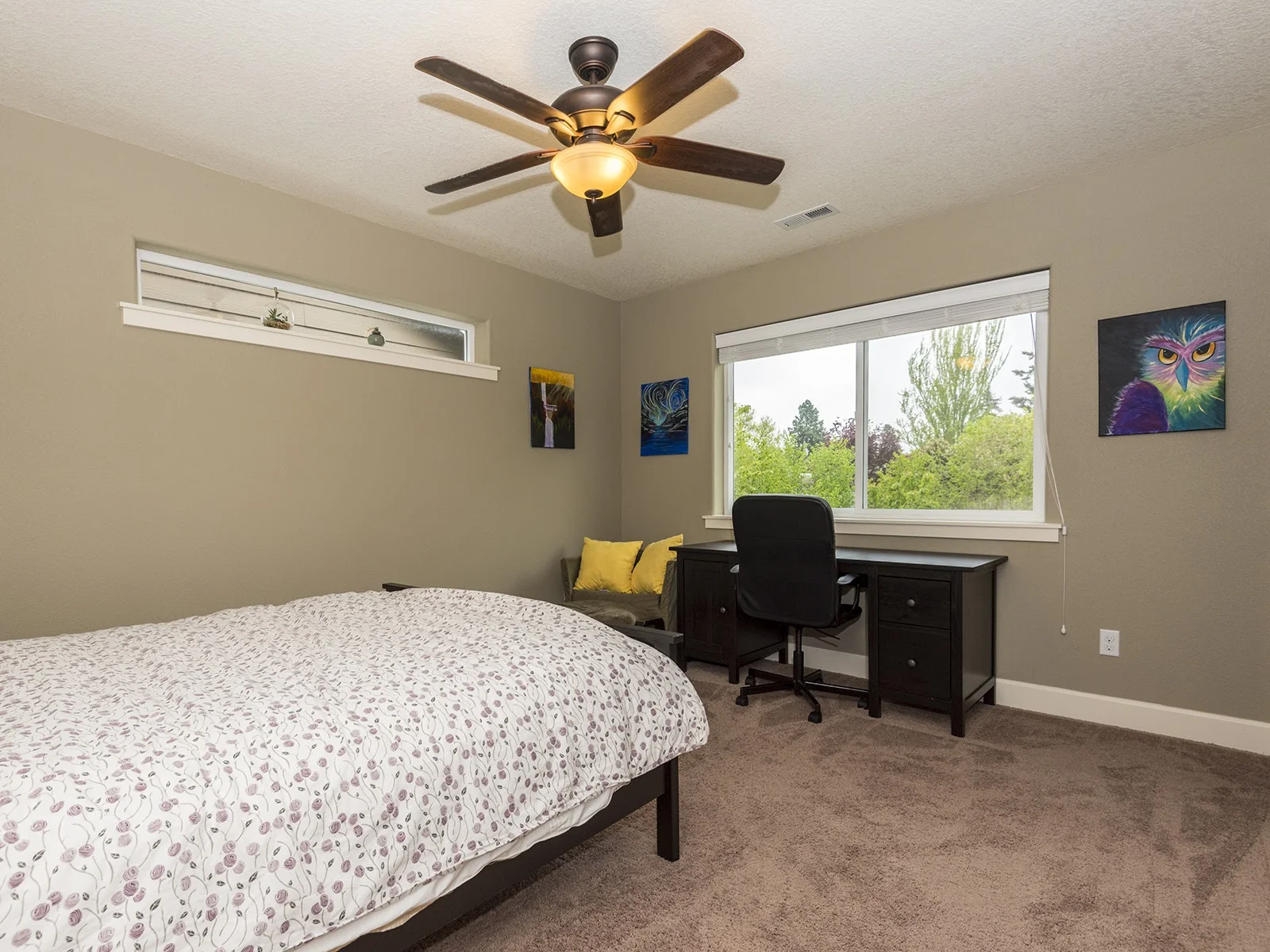 2nd bedroom with large window with a nice view