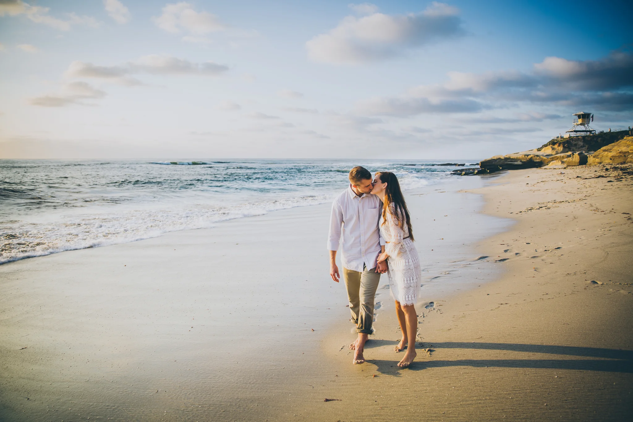 couple waking on the beach