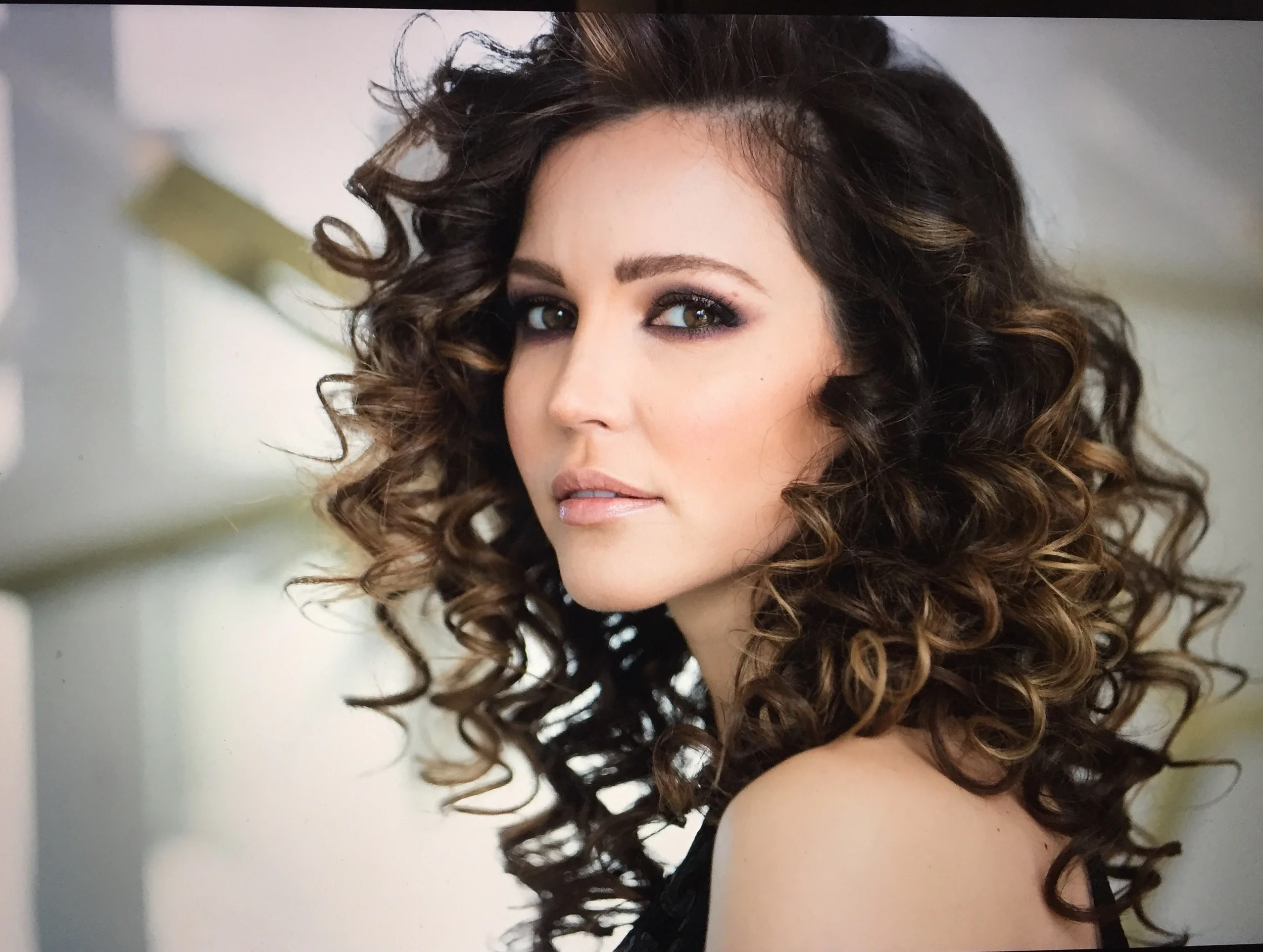 Let's talk curls. Irina's whole head was curled with a 1/2 inch wand and then pinned to the scalp to cool. After letting it rest for about 2 hours I had her flip so I could shake and spray. Love how they turned out.