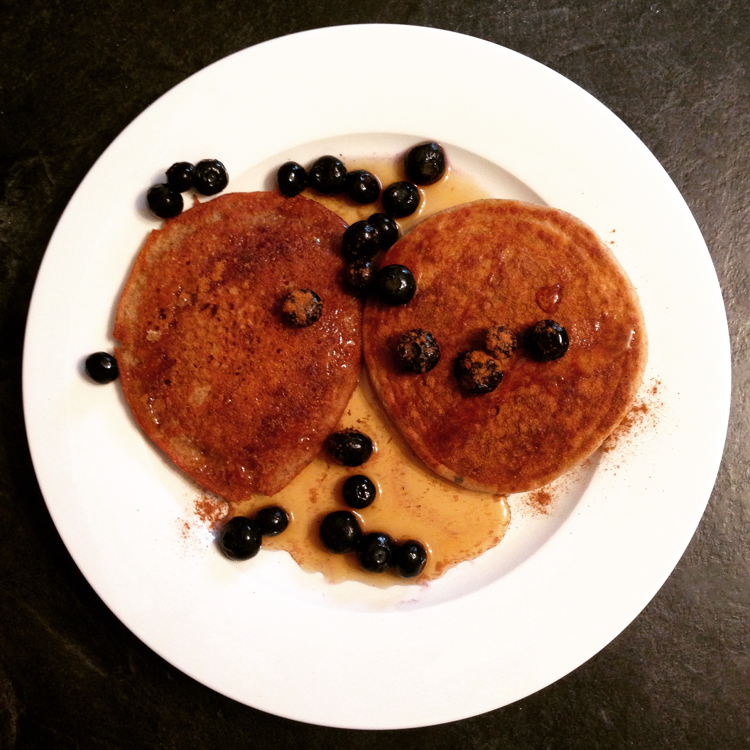 BUCKWheat pancakes with cinnamon, blueberries and pure maple syrup.