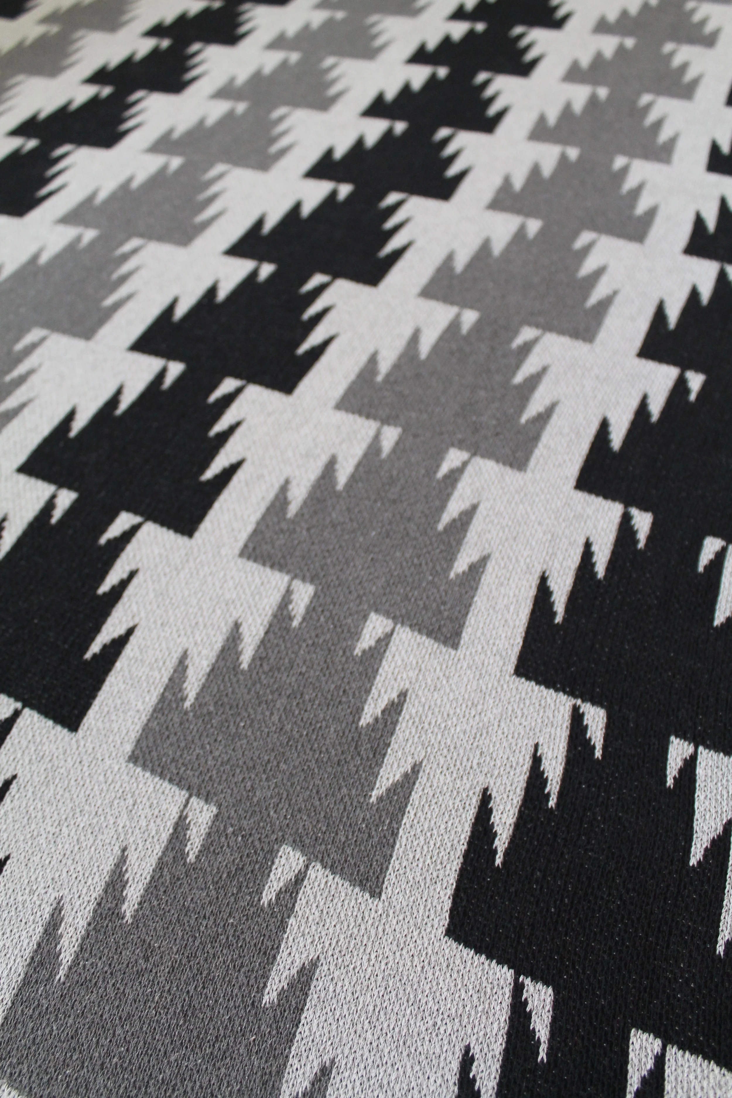 black and grey print throw blanket