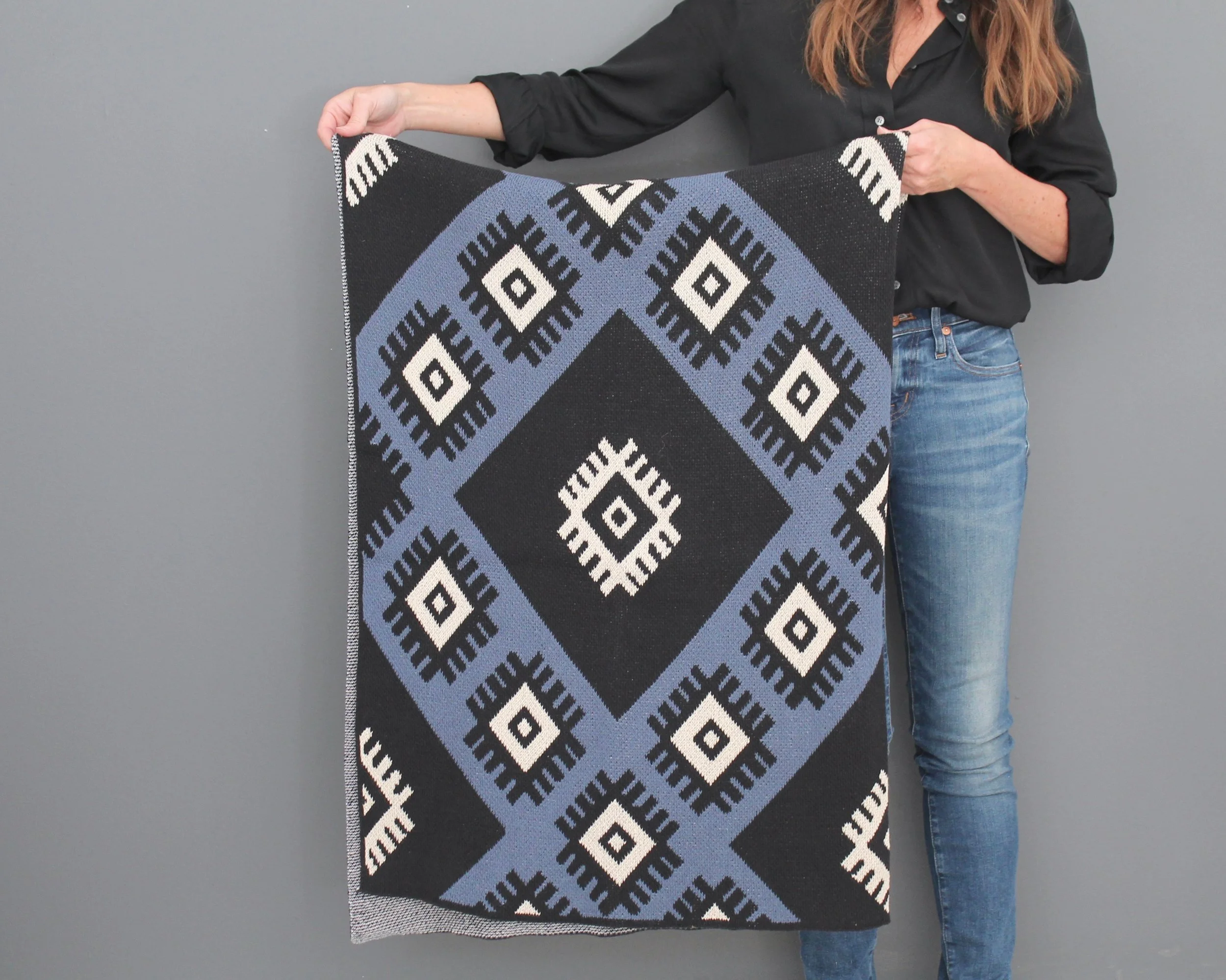 black and blue print throw