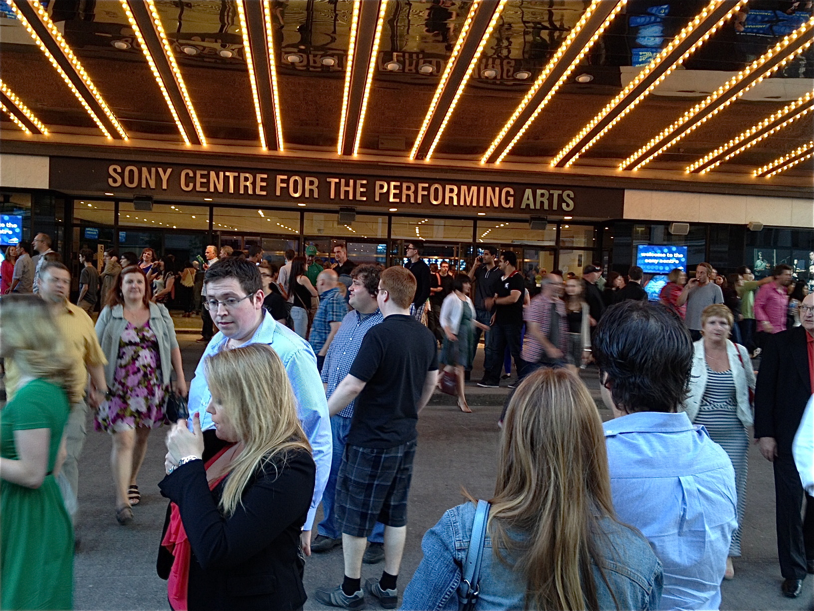 They wouldn't let us photograph the show, so here's a shot of outside the theatre. That guy clearly disapproves of his friend firing up a smoke.