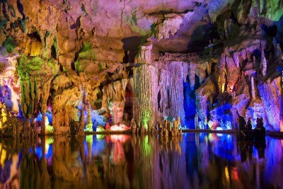 5911628-image-of-stalactite-and-stalagmite-formations-all-lighted-up-at-assembly-dragon-cave-yangshuo-guilin.jpg