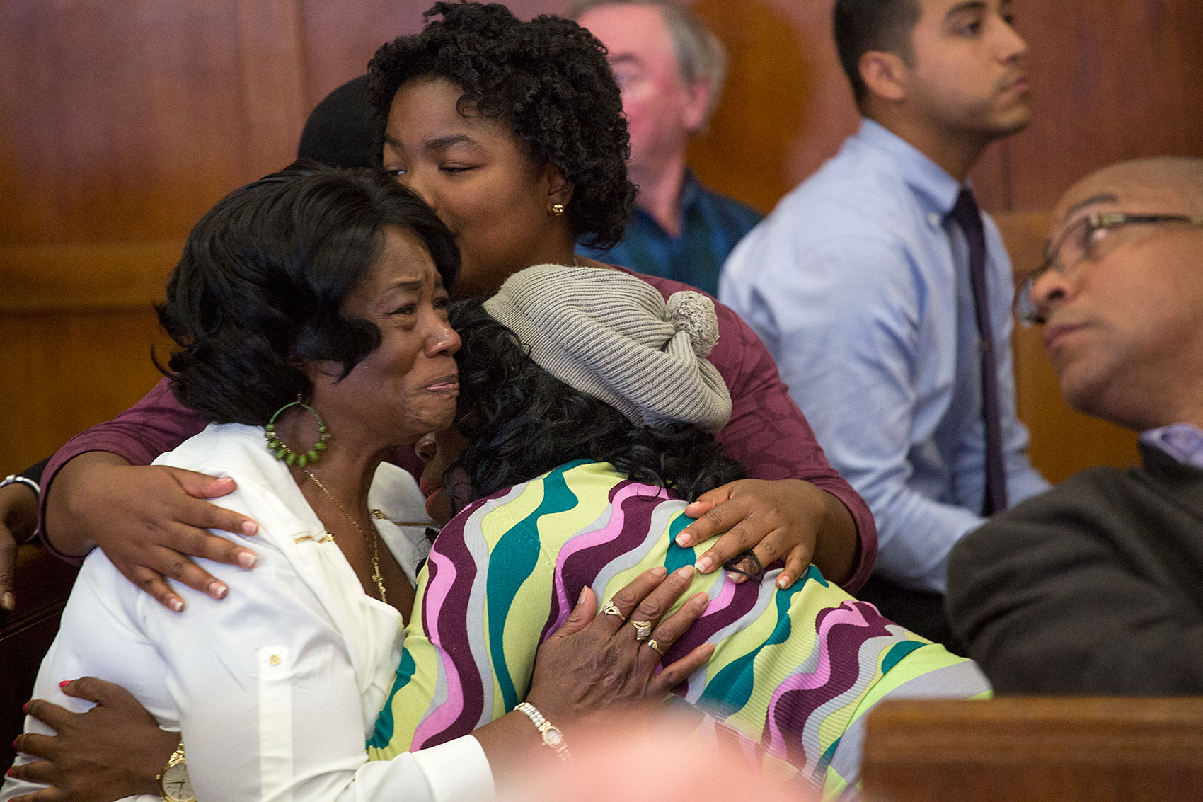 Sean's mother, Mary "Jacke" Ellis, with daughters Sharday (rear) and Janelle. (Jesse Costa/WBUR)