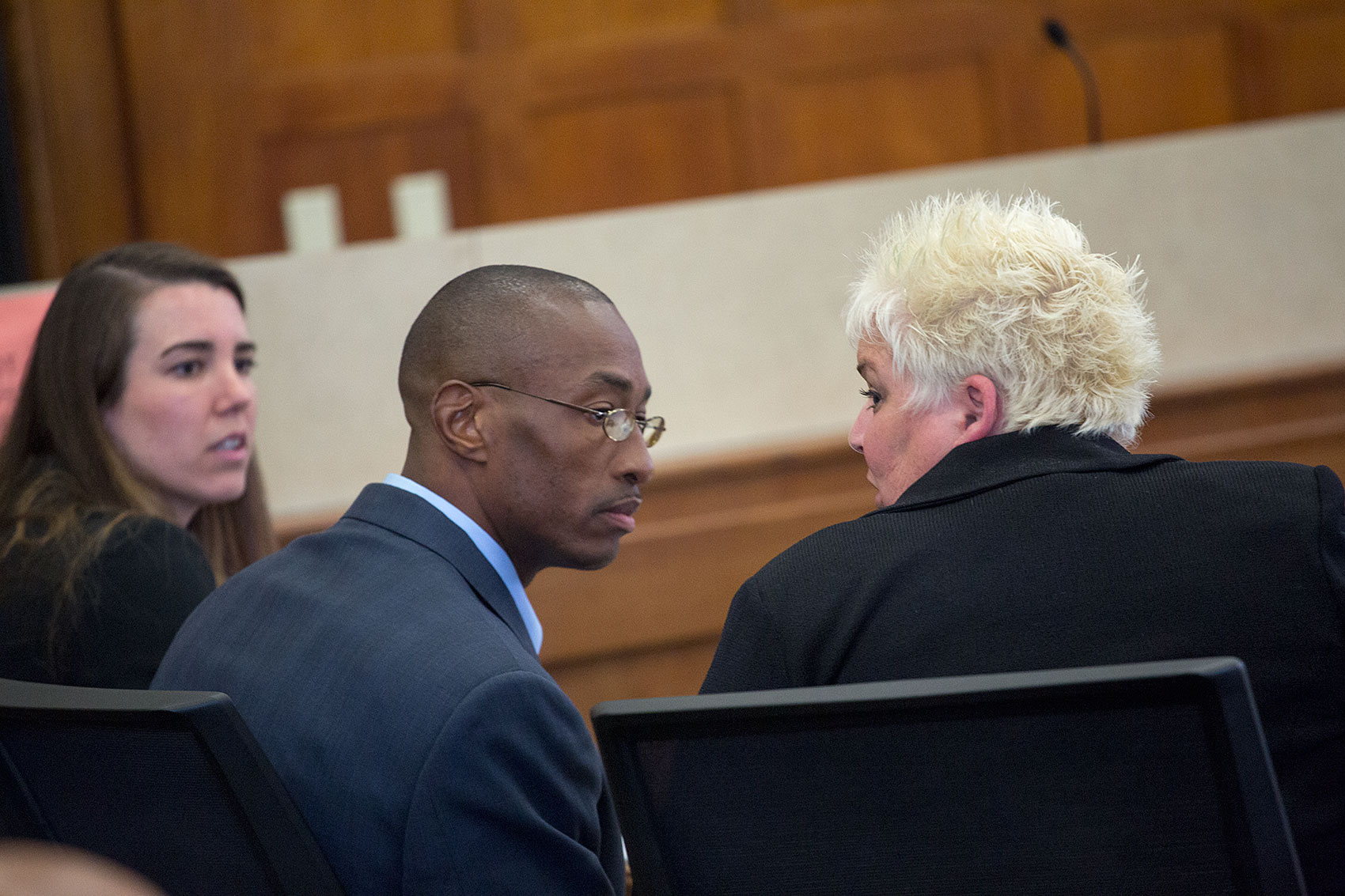 Sean Ellis confers with lead attorney Rosemary Scapicchio; attorney Jillise McDonough at left .