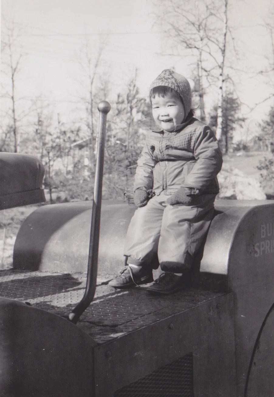 A photo of Janine from her childhood in Lexington, MA back during her pre-design days when she saw a future in heavy construction machinery.
