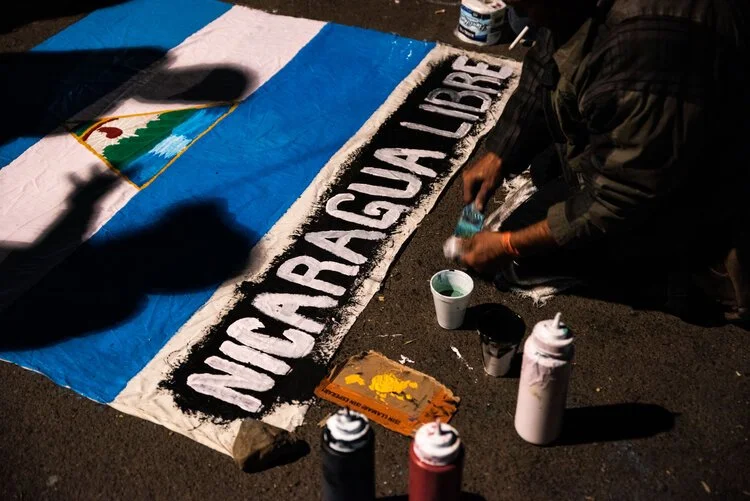  TIJUANA, MEXICO - Migrants from Central America work on protest banners to take to the border to demand their right to request asylum in the United States. 11/23/18 