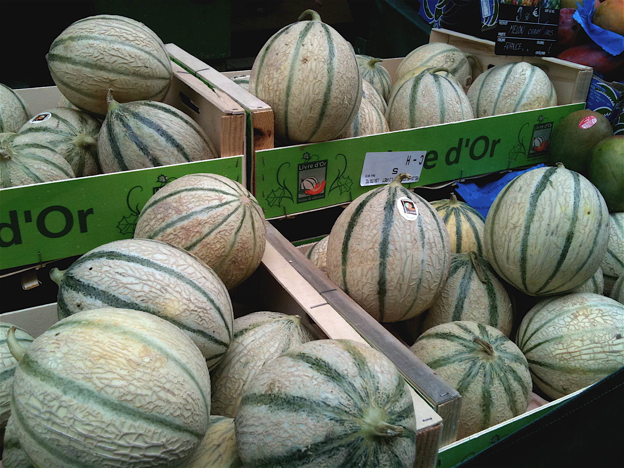 Charentais melons at Paris market….an inspiration for Emotionnelle perfume.