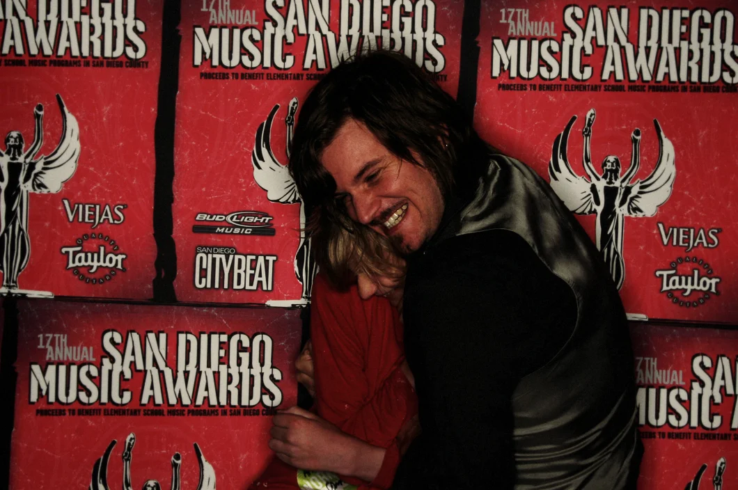 Caught accosting my son and fellow Wirepony member, Aaron Dennis of Tan Sister Radio a fter the Truckee Brothers performance at the SD Music Awards (2007). Photo Jeff Wiant