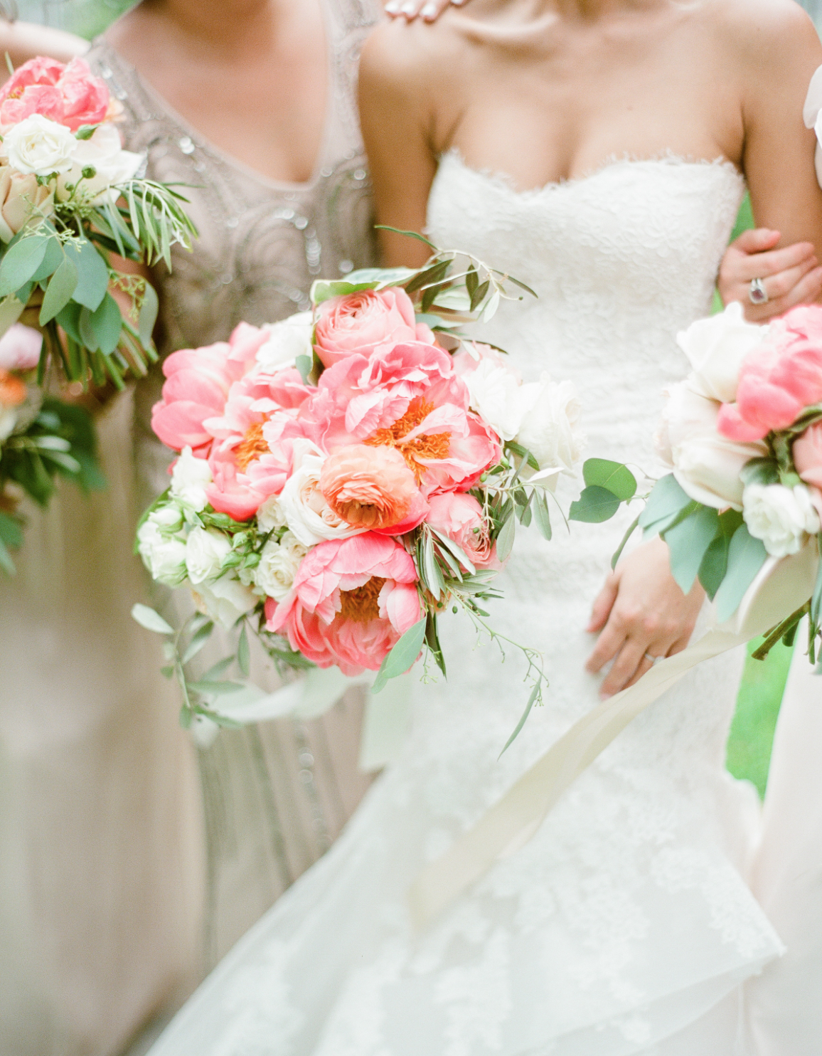Close-Up of the pink, coral and greenery bouquets by Maxit Flower Design.