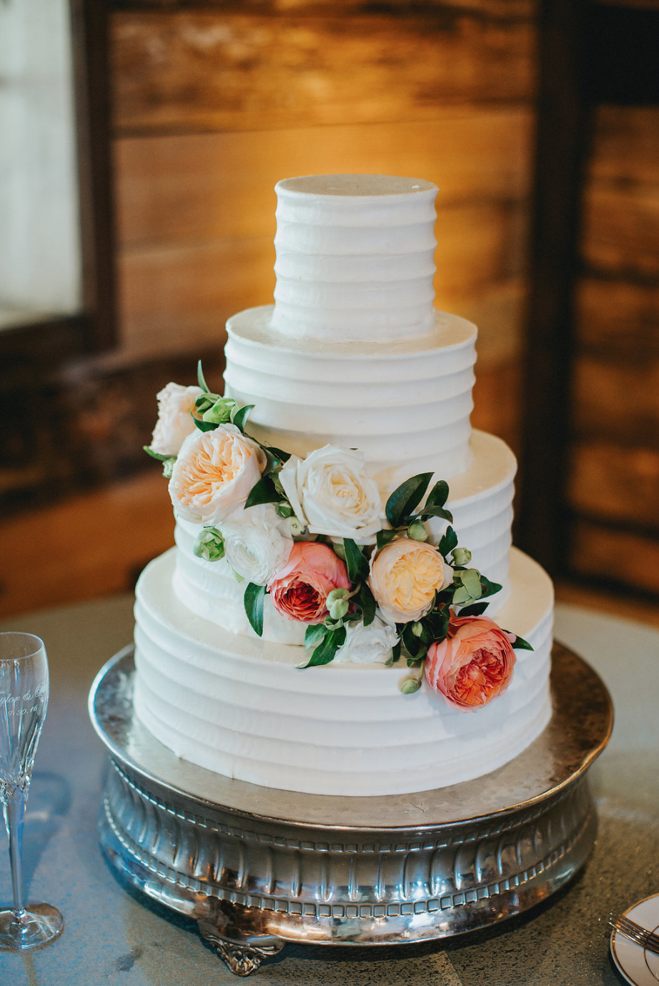 Simple cake with floral accents provided by Maxit Flower Design
