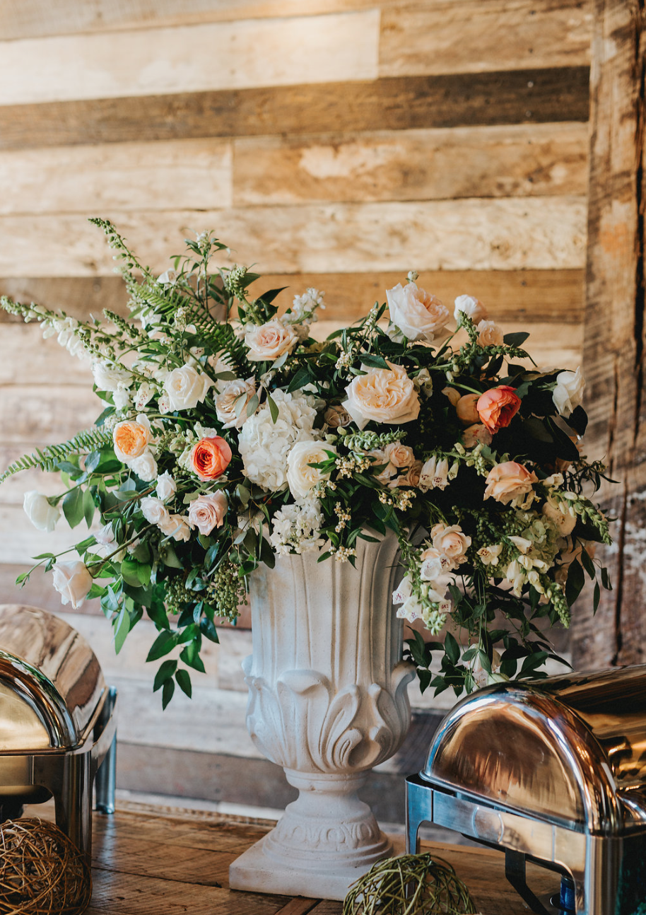Large Urn style arrangement by the buffet. Maxit Flower Design