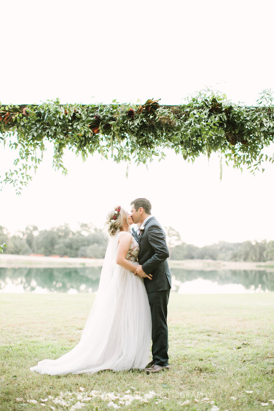 You may now kiss your bride. Arch & Flower crown by Maxit Flower Design in Houston, TX.