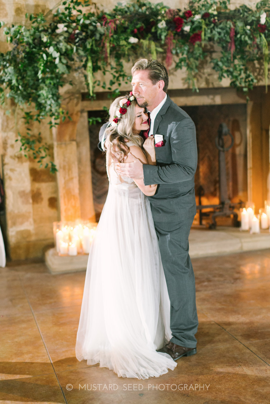 Sweet moment between daughter and father. Fireplace florals by maxit flower design in houston, tx