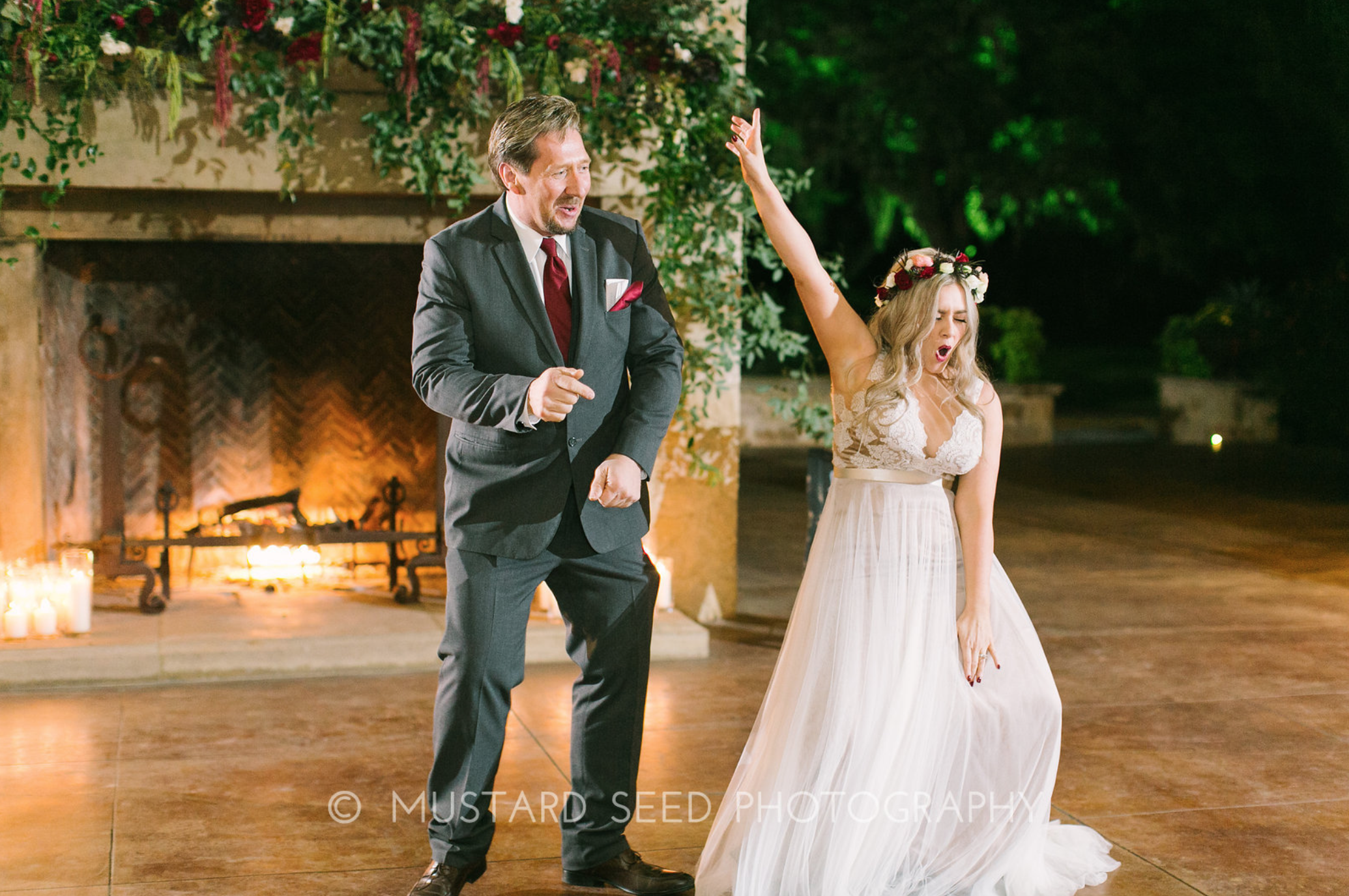 Fun moment during the father-daughter dance. Floral installation by Maxit Flower Design in Houston, TX.