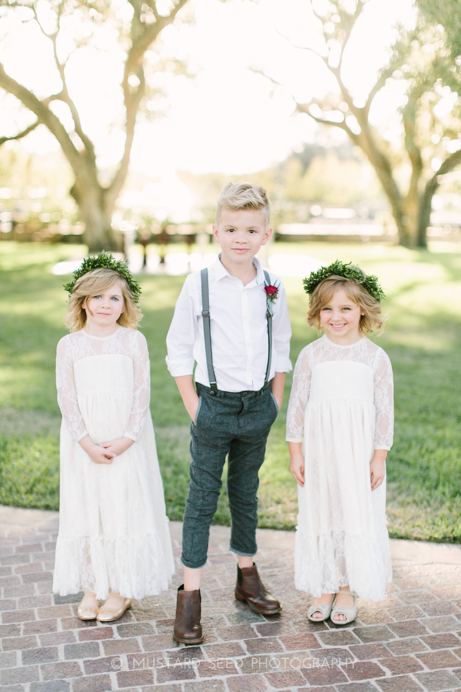 Flower Girls with flower crowns and Ring bearer in suspenders