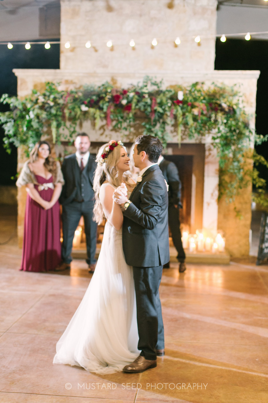 First Dance in front of a fireplace.