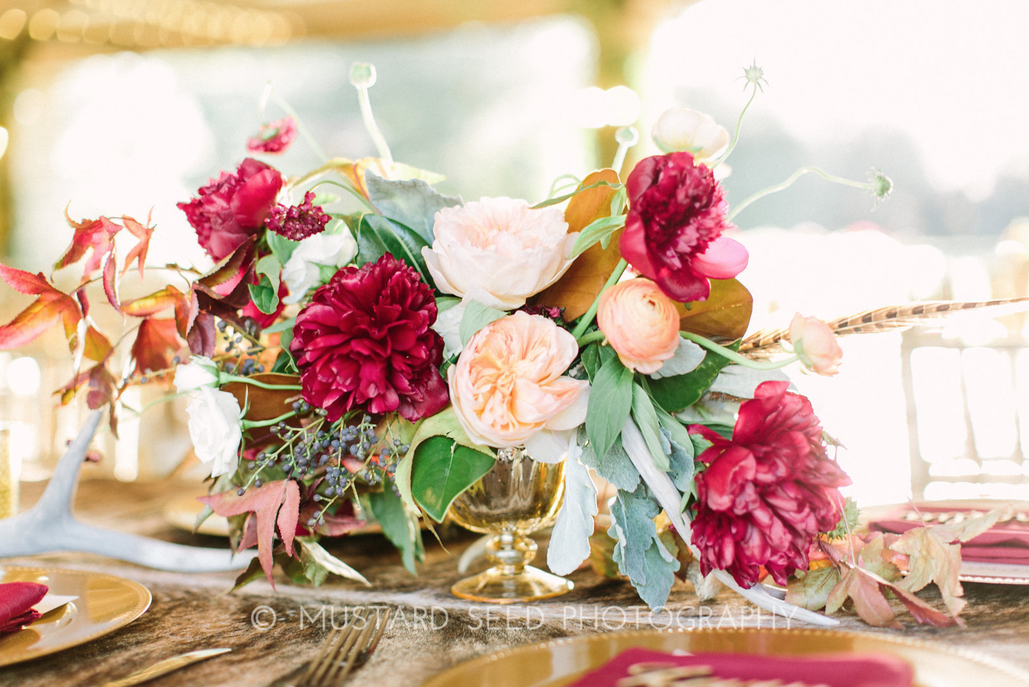 Compote centerpiece with marsala, orange, greenery and blush by Maxit Flower Design in Houston, TX