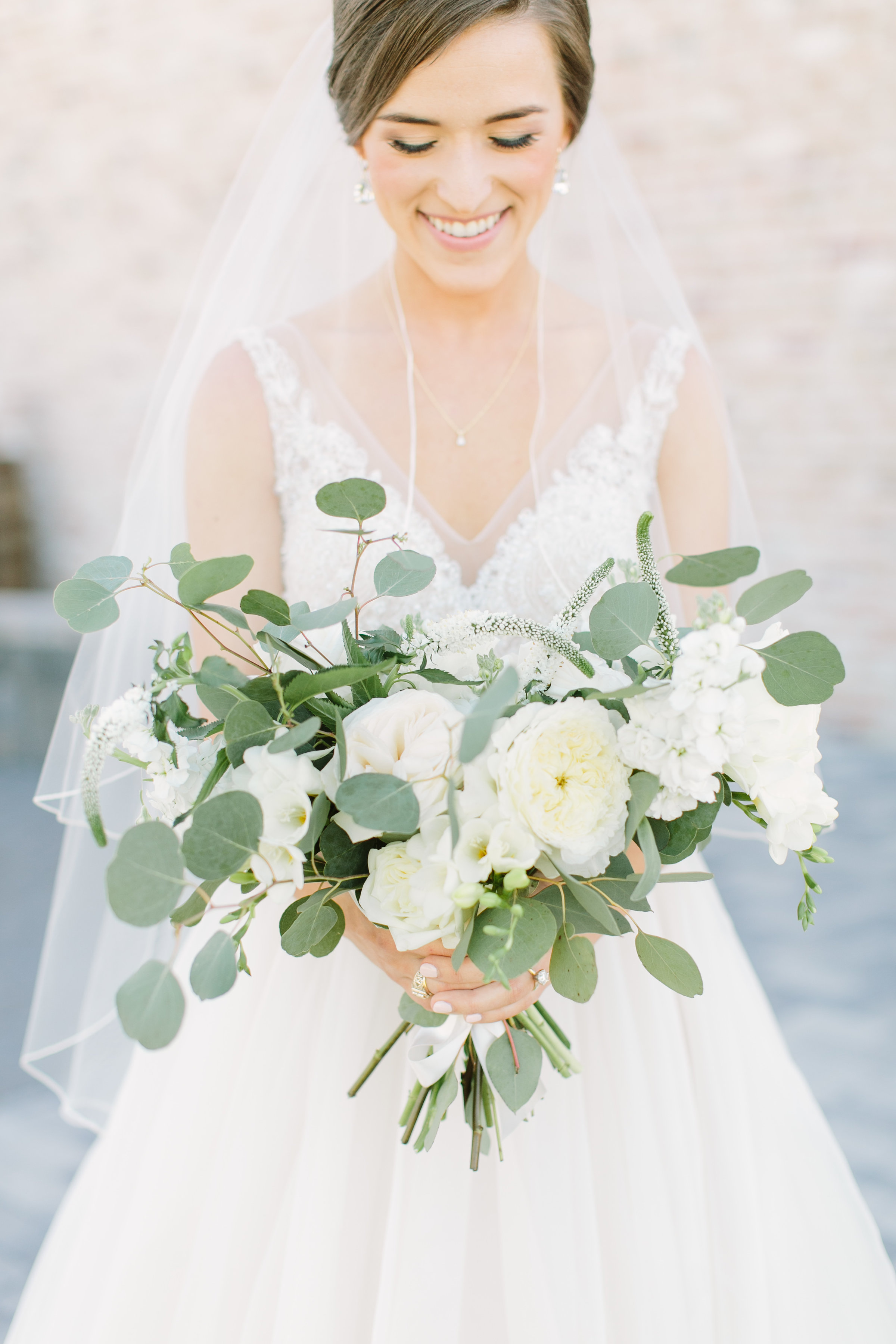 Bridal Bouquet With Bride in all white dress.JPG