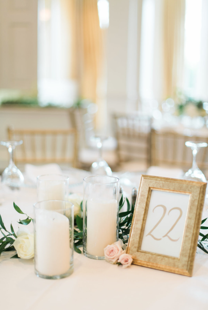 wedding-details-photography-dana-fernadez-river-oaks-country-club-table-number-gold-pillar-candle-reception-decor-floral-greenery-by-maxit-flower-design-houston-texas