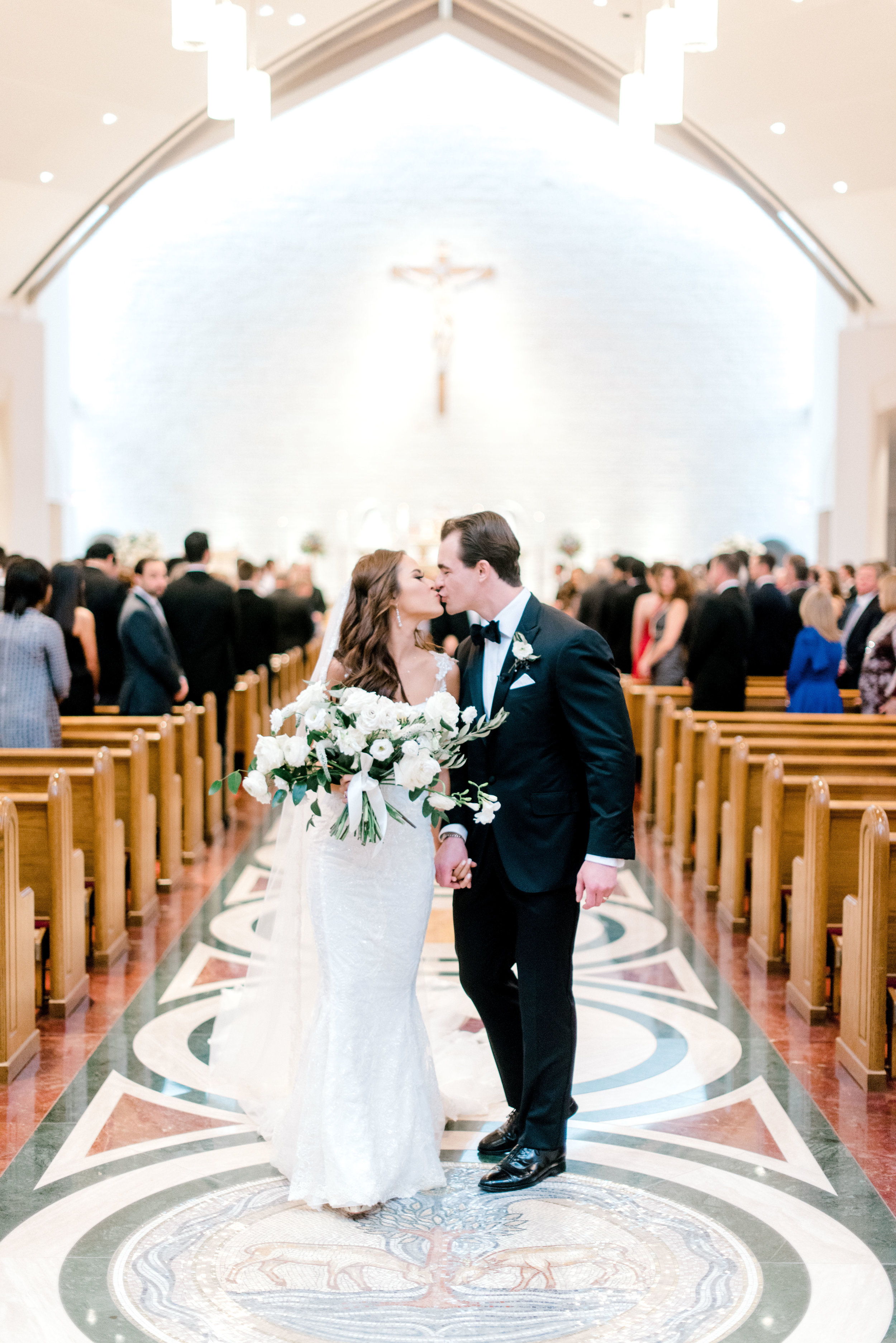 wedding-details-photography-dana-fernandez-bride-groom-ceremony-kiss-bridal-bouquet-Freesia-Lisianthus-Veronica-peony-floral-greenery-by-maxit-flower-design-houston-texas