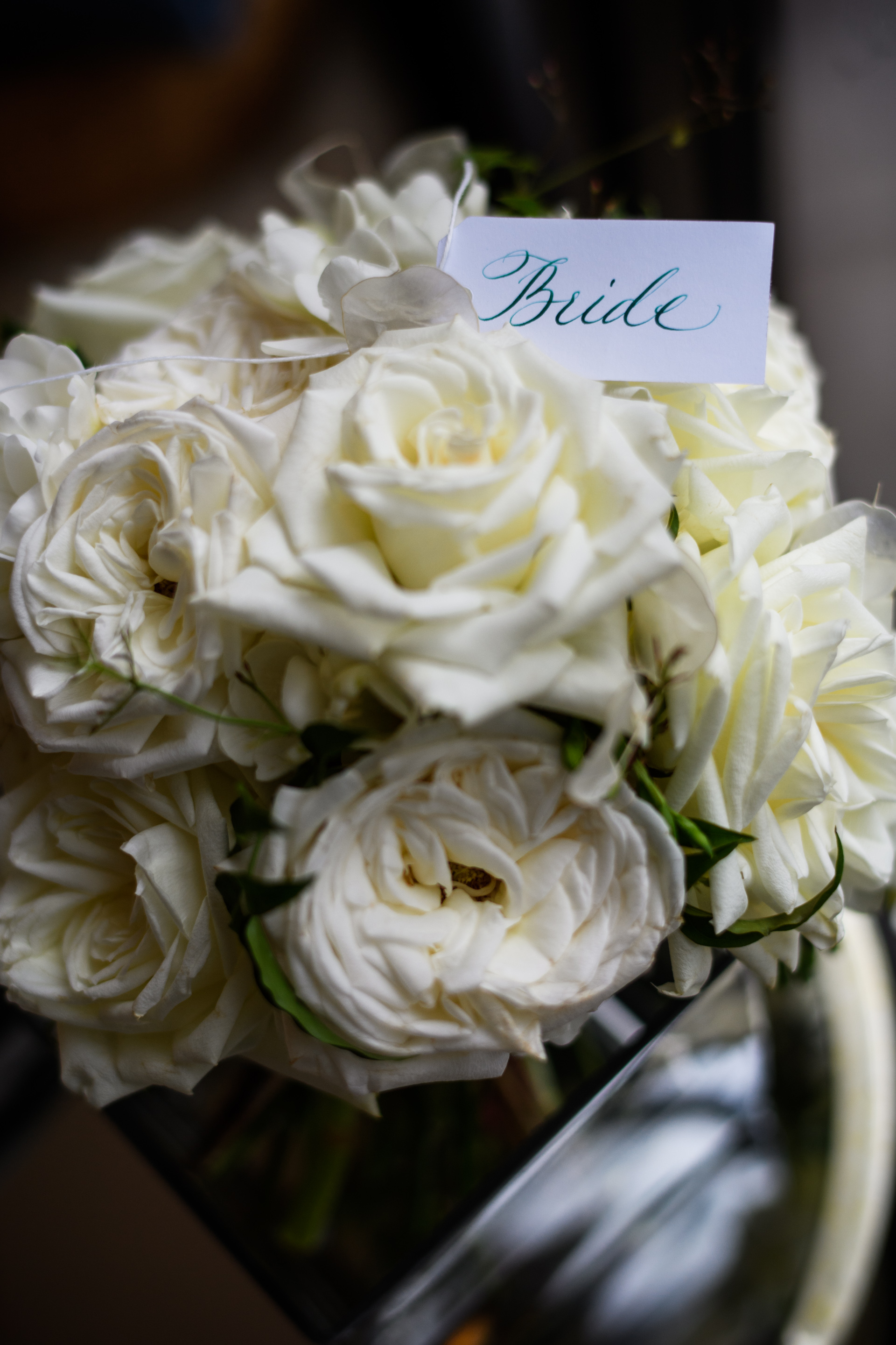 The bride asked for a simple and classic design. We incorporated scented garden roses with roses and touches of jasmine vine for that delicate touch or greenery. Calligraphy by Jenny @ A Fine Flourish