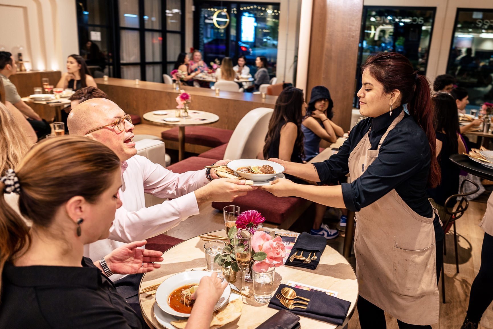  Guests being served Dinner at Sunday Press' Sunday Supper Club located in Houston, TX within the Garden Oaks/Oak Forrest area. The Supper Club menu changes each event. Be sure to may time for the next Sunday Supper Club at Sunday Press. 