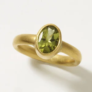 Dianna Ring The simple domed band highlights the beauty of any stone. Shown here with a Peridot. 