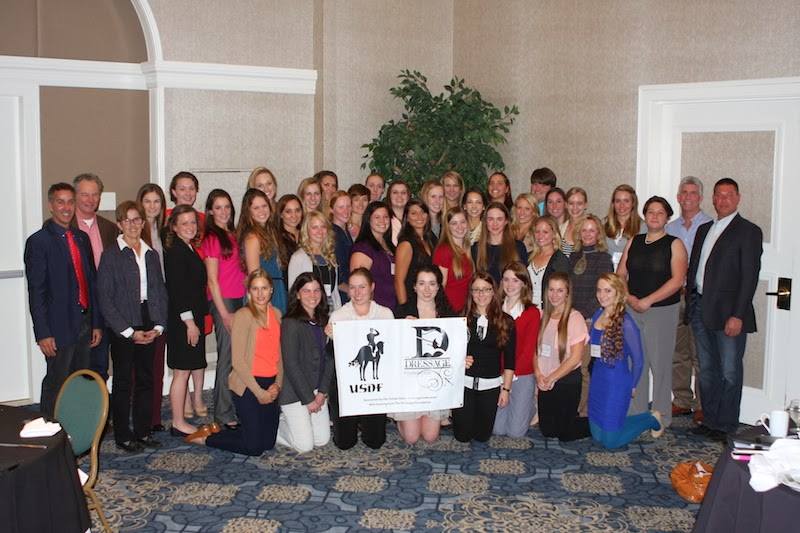 The 2014 USDF/USEF Young Rider Graduate Program participants and special dinner guests. From left: Robert Dover, Stephan Hienzsch, USDF Youth Programs Committee chair Roz Kinstler. Middle row, second from right: Debbie McDonald. At right: George Williams, Scott Hassler. Photo by Victoria Trout/USDF. 