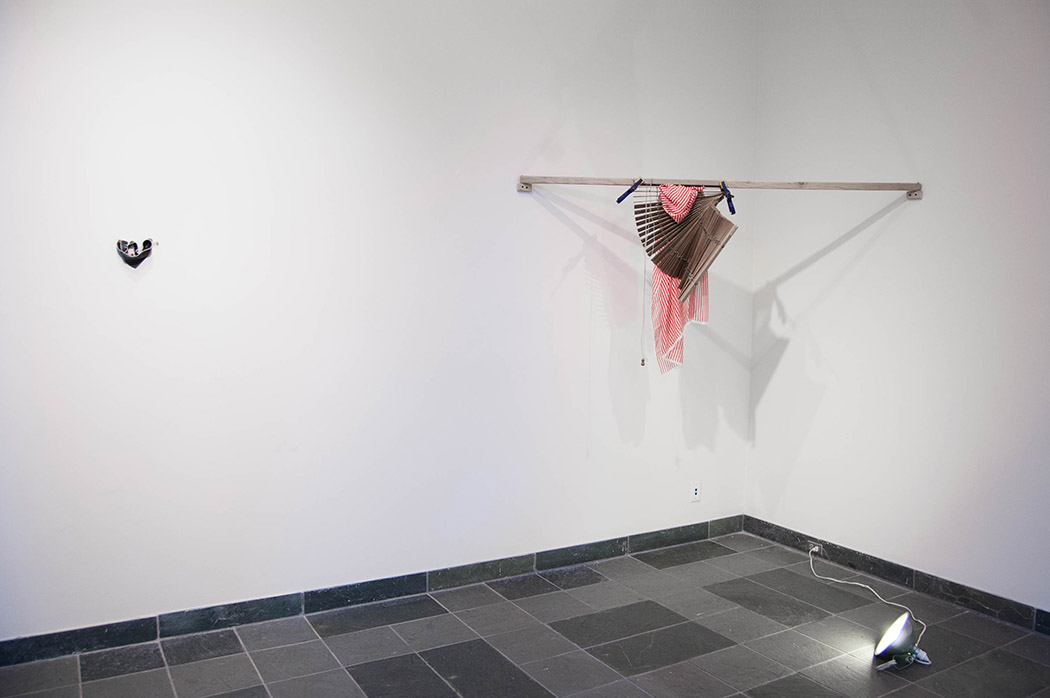 Elonda Billera Between you and me We are all potential energy., 2017 Rubber band, push pins and button holes Dimensions variable Between you and me: blinds, 2017 Venetian blinds, striped fabric, quick clamps, lumber, clamp light Dimensions variable 