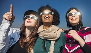 3-Women-Watching-Total-Solar-Eclipse-photo-Columbia-SC-iStock-LeoPatrizi.jpg