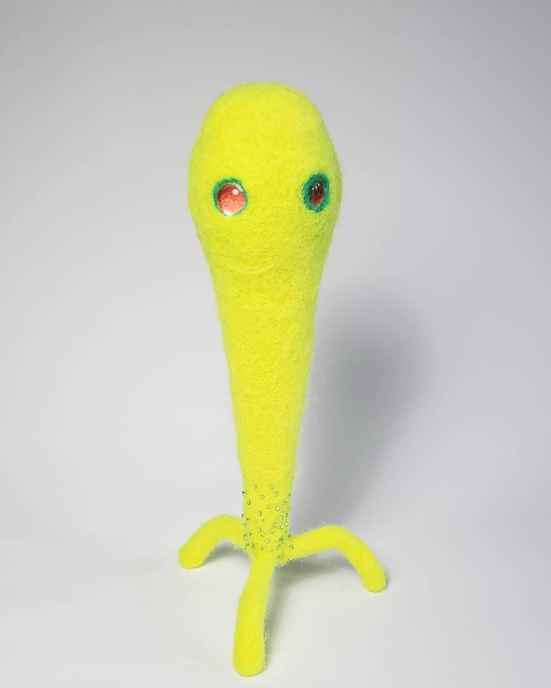 8.5&quot; tall neon yellow guy ⬆️💡
.
#shannonowenfiber #fibersculpture #fiberartist #softsculpture #somervilleartist #feltedwool #uvreactive #blacklightartwork #livingincolor