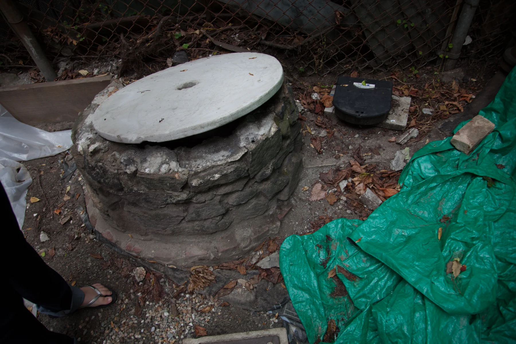 An existing well from the original neighborhood is located in the courtyard. While no longer active, it reaches a depth of nearly twenty feet and presented an opportunity for a future site element. 