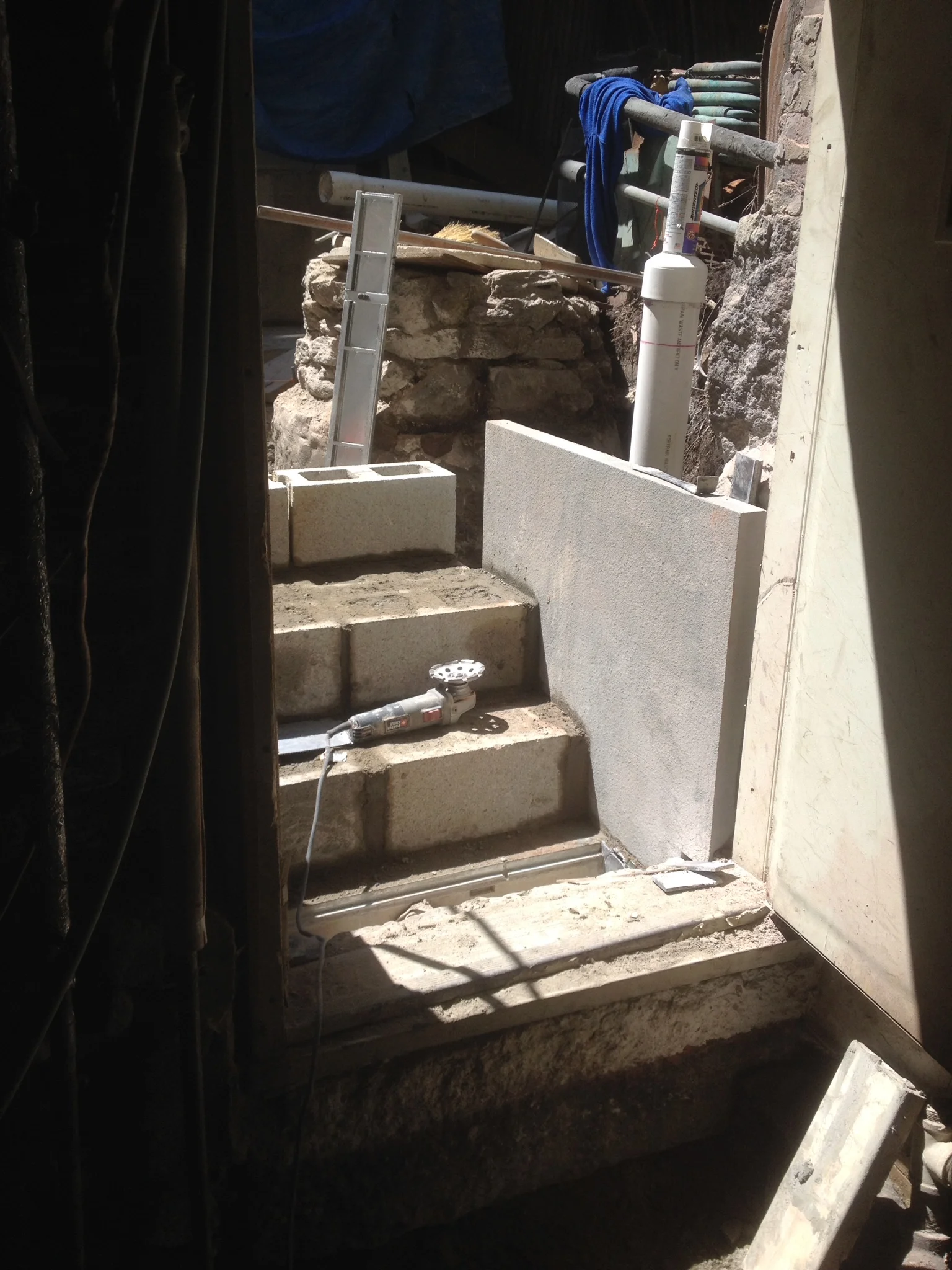 A lower set of steps were built in a similar manner, with a vertical piece of bluestone retaining grade on the sides. A brickslot drain was incorporated at the bottom so that water would not be a future problem. 