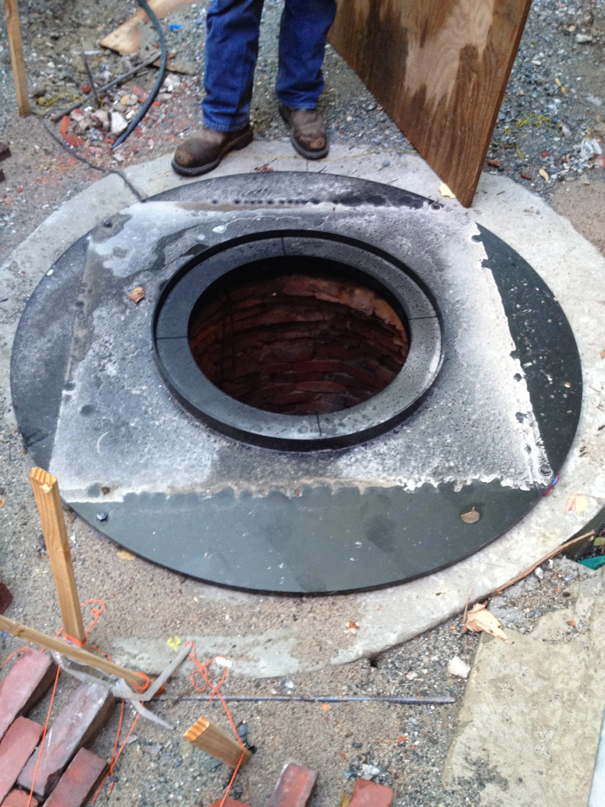 The steel well frame that will support the glass viewport is installed. While only the inner circle will be exposed at completion, a 1" thick subsurface piece was required for adequate safety. 
