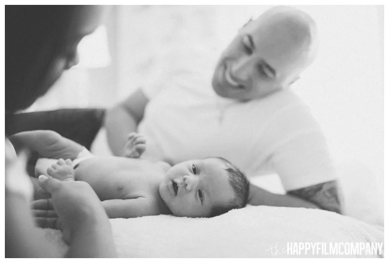 black and white dad with baby - Natural Seattle Newborn Photography - the Happy Film Company