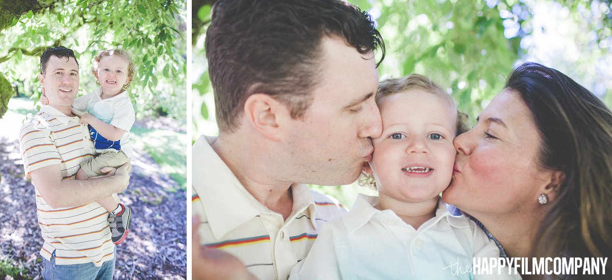 Mom and Dad kissing their son - the Happy Film Company - Seattle Family Photos