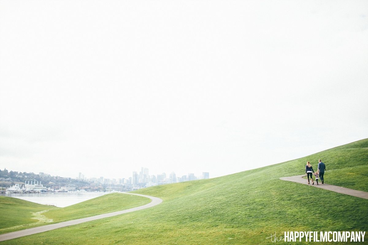 Family Walking in the big grassy hill - the Happy Film Company - Seattle Family Photos