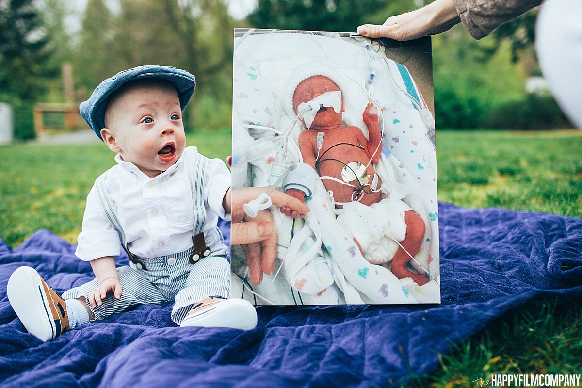 Little boy holding his baby photo -the Happy Film Company - Seattle Family Photos