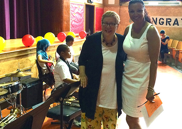 DK Holland and Principal Lena Barbera prepare for the PS 20 5th grade commencement