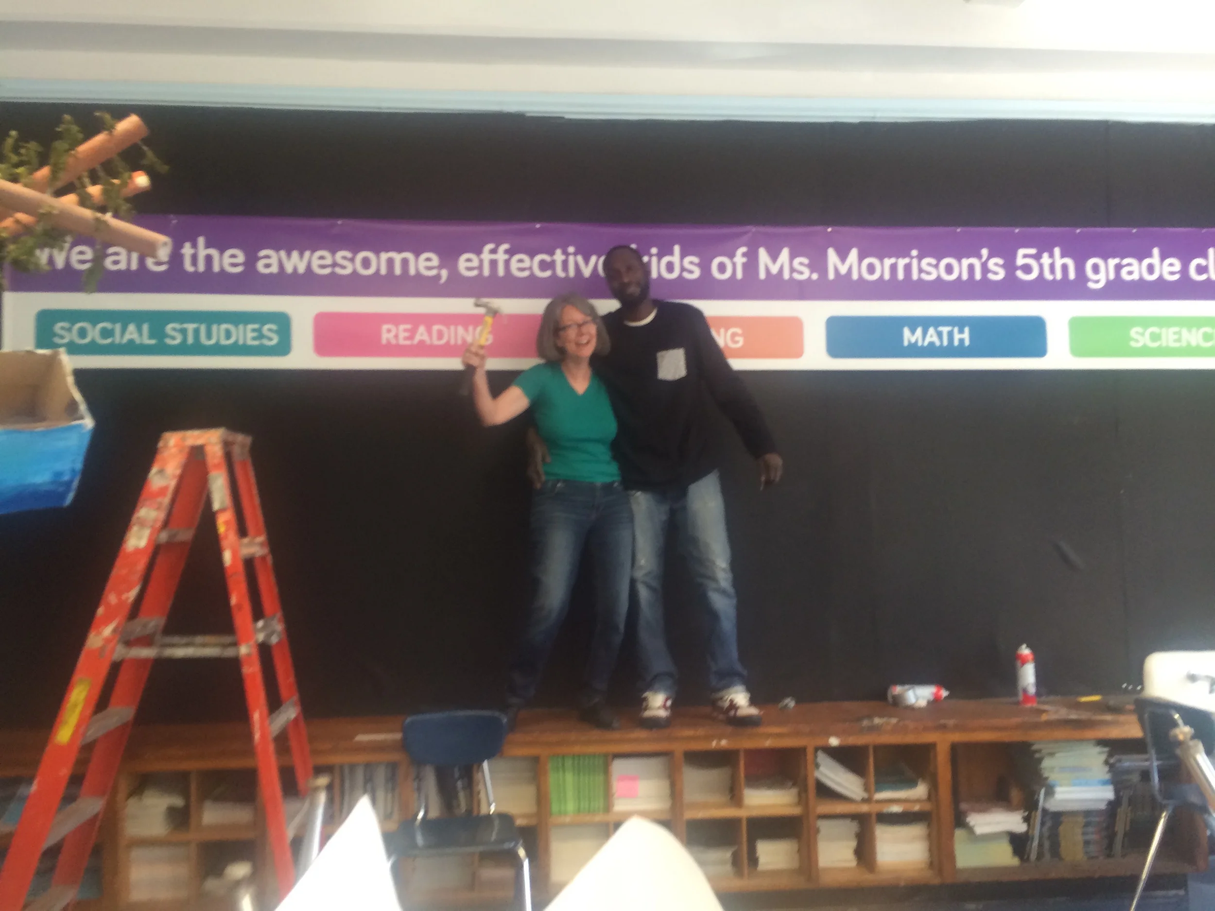 Monica Snellings and Nate the custodian completed the installation of the banner. This was no mean feat.