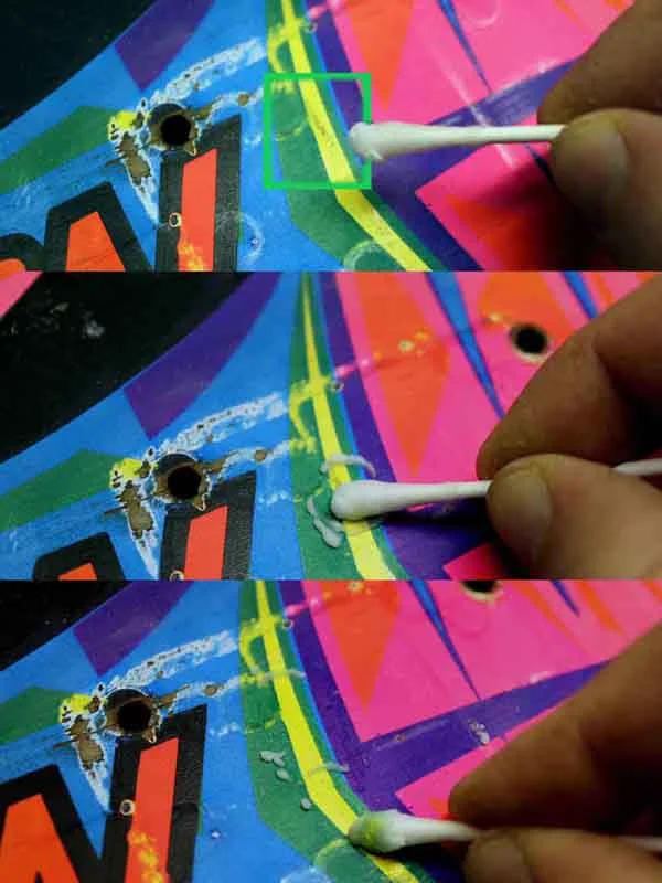 Smudge removal from a colored area while keeping in check with pigment loss.